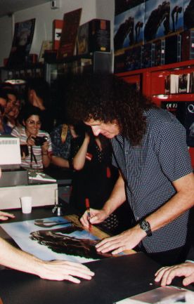 Brian signin' an "Another World" record