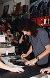 Brian signin' an "Another World" record