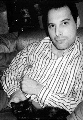 Freddie with one of his cats (Goliath?)