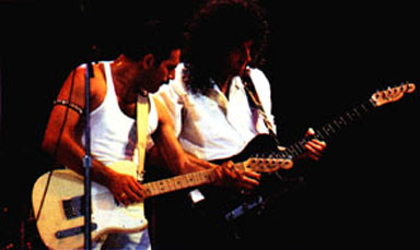 Brian shows Freddie how to play...