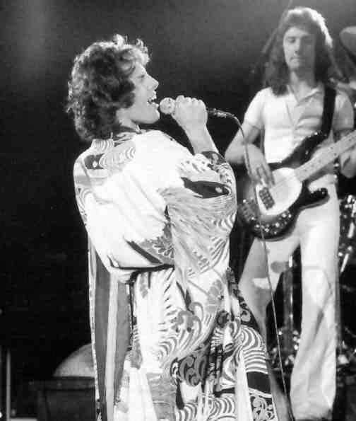 Freddie on stage with John