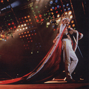 Freddie wearing a crown and robe