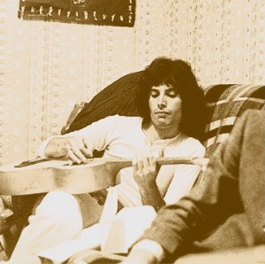 Freddie Lounges With Guitaur