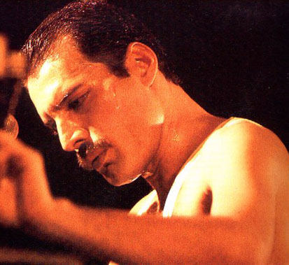 Freddie looking down at the piano