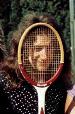 John playing tennis