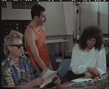 Guys writing lyrics of "One Vision" down