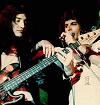 Freddie leaning on John