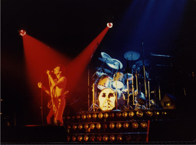 Red Freddie, Blue Drums, and John standing behind Freddie