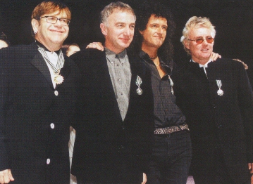 Brian, Roger and John with Sir Elton John