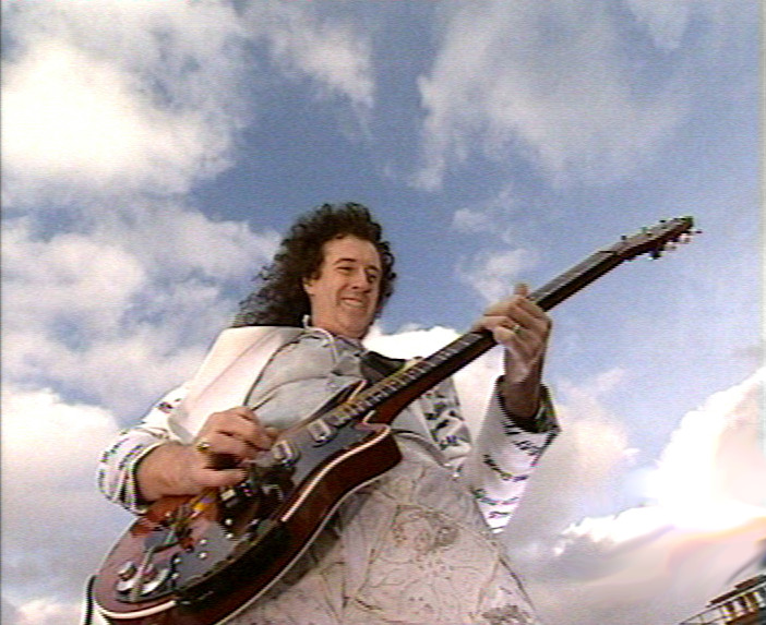 Brian performs GSTQ on the roof of Buckingham Palace June 3rd 2002