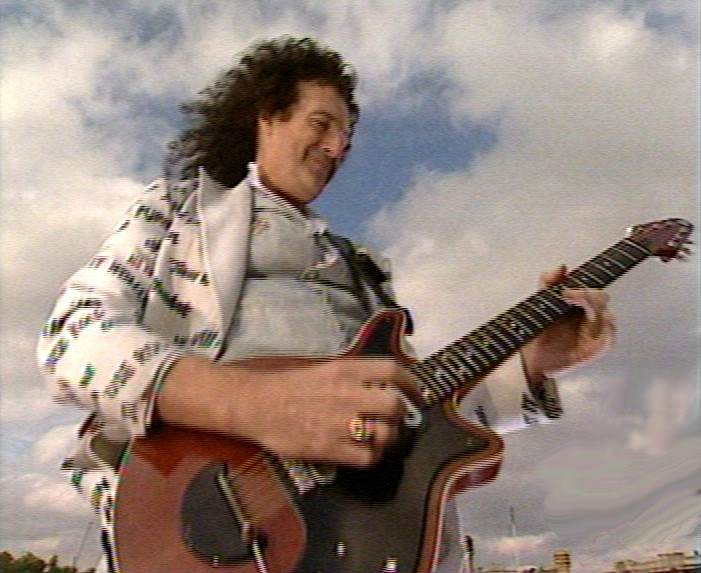 Brian performs GSTQ on the roof of Buckingham Palace June 3rd 2002